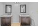 Bathroom featuring double sink vanity with modern framed mirrors and matching dark cabinetry at 305 Bryan Oak Ave, Brandon, FL 33511