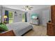 Bright bedroom with natural light from the windows, a ceiling fan, and a light color palette at 305 Bryan Oak Ave, Brandon, FL 33511