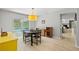 Bright dining area with a pool view and stylish furnishings at 305 Bryan Oak Ave, Brandon, FL 33511