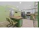 Inviting kitchen featuring an island, stainless steel appliances, and adjacent dining area at 305 Bryan Oak Ave, Brandon, FL 33511