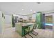 Spacious kitchen with an island, modern appliances, and a view of the pool at 305 Bryan Oak Ave, Brandon, FL 33511