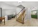 Open-concept living area with modern flooring and staircase to upper level at 305 Bryan Oak Ave, Brandon, FL 33511