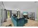 Open living room with fireplace, large windows, and hardwood floors, perfect for relaxing and entertaining at 305 Bryan Oak Ave, Brandon, FL 33511