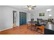 Office area featuring a desk, a printer, and a curtained-off closet for privacy and storage at 305 Bryan Oak Ave, Brandon, FL 33511