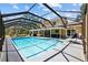 A screened-in pool with outdoor seating and a sunny patio, perfect for relaxing and entertaining at 305 Bryan Oak Ave, Brandon, FL 33511