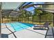 Lanai view of a pool with screened in enclosure and lounge chairs at 305 Bryan Oak Ave, Brandon, FL 33511