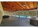 Covered lanai with outdoor furniture overlooking a pool with screened in enclosure at 305 Bryan Oak Ave, Brandon, FL 33511
