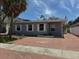 Charming single-story home featuring neutral gray siding and a spacious front driveway at 310 79Th Ave, St Pete Beach, FL 33706