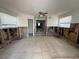 Spacious living room features tile floors and large windows, ready for renovation at 310 79Th Ave, St Pete Beach, FL 33706