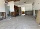 Open floorplan living room with tile floors and damaged wall panels, waiting for improvements at 310 79Th Ave, St Pete Beach, FL 33706