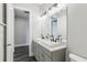 Bathroom boasts double sinks, marble counters, and modern fixtures at 32860 Drake Estates Way, Dade City, FL 33525