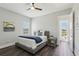 Bedroom with a ceiling fan, wood floors, and a window with natural light at 32860 Drake Estates Way, Dade City, FL 33525