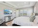 Spacious bedroom with tray ceiling, plush rug, and serene views, creating a relaxing and comfortable environment at 32860 Drake Estates Way, Dade City, FL 33525