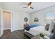 Bedroom with a ceiling fan, wood floors, and neutral walls at 32860 Drake Estates Way, Dade City, FL 33525