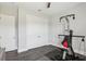 Room featuring wood floors, gym equipment, and bright neutral paint at 32860 Drake Estates Way, Dade City, FL 33525