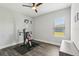 Room featuring wood floors, gym equipment and a window to the backyard at 32860 Drake Estates Way, Dade City, FL 33525
