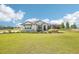 Charming one-story home featuring stone accents, manicured landscaping, and a spacious green lawn at 32860 Drake Estates Way, Dade City, FL 33525