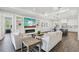 Bright living room with modern decor, fireplace, built-in shelving, and an open connection to the kitchen at 32860 Drake Estates Way, Dade City, FL 33525