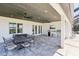 Outdoor patio features ceiling fans, outdoor dining, and grill area at 32860 Drake Estates Way, Dade City, FL 33525
