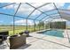 The enclosed pool features a fire pit and beautiful views of the lush, green pastures at 32860 Drake Estates Way, Dade City, FL 33525