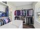 Organized walk-in closet featuring ample shelving and hanging space, perfect for wardrobe storage and dressing at 32860 Drake Estates Way, Dade City, FL 33525