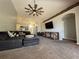 Open living room showcasing a ceiling fan, recessed lights, and seamless access to the kitchen at 3414 Berry Blossom Ln, Plant City, FL 33567