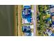 Aerial view of luxury homes with manicured lawns, pools, and waterfront access at 3420 Channelside Ct, Safety Harbor, FL 34695