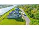 New homes along a waterfront, showcasing well-maintained lawns and landscaping, with a scenic canal and bridge at 3420 Channelside Ct, Safety Harbor, FL 34695