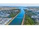 Breathtaking aerial view showcasing a scenic waterway and charming waterfront community at 3420 Channelside Ct, Safety Harbor, FL 34695