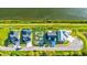 Aerial view of waterfront homes, new construction foundation, and a well-manicured lawn; canal running alongside at 3420 Channelside Ct, Safety Harbor, FL 34695