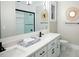 Bright bathroom with double vanity, stylish mirrors, and sleek fixtures at 3420 Channelside Ct, Safety Harbor, FL 34695