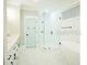 Bright bathroom with white cabinets, shower, and tub at 3420 Channelside Ct, Safety Harbor, FL 34695