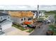 Construction of a new home in a residential neighborhood. Crane and equipment on site at 3420 Channelside Ct, Safety Harbor, FL 34695