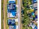Aerial view of home foundation construction; features plumbing with bordering landscaping near other properties at 3420 Channelside Ct, Safety Harbor, FL 34695