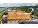 Framing phase of a new home showing lumber details and construction crew on site at 3420 Channelside Ct, Safety Harbor, FL 34695