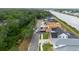 Aerial shot of home under construction located alongside a serene canal at 3420 Channelside Ct, Safety Harbor, FL 34695