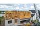 New home construction showing the framing, foundation, and workers on the second floor at 3420 Channelside Ct, Safety Harbor, FL 34695