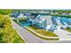 A charming two-story home featuring a manicured lawn at 3420 Channelside Ct, Safety Harbor, FL 34695