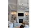 Cozy living room with a fireplace and built-in shelves at 3420 Channelside Ct, Safety Harbor, FL 34695