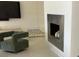 Bright Living Room featuring a metal fireplace, sleek furniture and contemporary accents at 3420 Channelside Ct, Safety Harbor, FL 34695