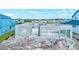 A new home under construction featuring concrete block walls with a view overlooking surrounding homes at 3420 Channelside Ct, Safety Harbor, FL 34695