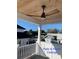 Covered patio with a ceiling fan and tongue and groove ceiling offering outdoor comfort at 3420 Channelside Ct, Safety Harbor, FL 34695