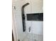 Modern shower features a subway tile surround and rainfall shower head at 3420 Channelside Ct, Safety Harbor, FL 34695