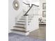 Classic staircase with wood treads and white risers at 3420 Channelside Ct, Safety Harbor, FL 34695