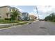 Street view of new home under construction, situated among other residences at 3420 Channelside Ct, Safety Harbor, FL 34695