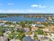 Beautiful aerial view of home with large backyard and waterfront views. This home is a must-see! at 349 Belleair Ne Dr, St Petersburg, FL 33704