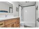 Cozy bathroom featuring wood cabinets, white countertops, and a shower/tub combo with subway tile at 349 Belleair Ne Dr, St Petersburg, FL 33704