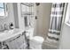 Bathroom featuring a standing shower with a tile surround and white and gray striped curtain at 349 Belleair Ne Dr, St Petersburg, FL 33704