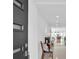 Elegant entryway with a modern front door, neutral walls, and view of living area at 349 Belleair Ne Dr, St Petersburg, FL 33704