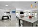 Kitchen island featuring a white countertop and views into an adjacent game area with ping pong table at 349 Belleair Ne Dr, St Petersburg, FL 33704
